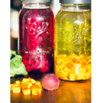 Beet kvass in jars on counter.