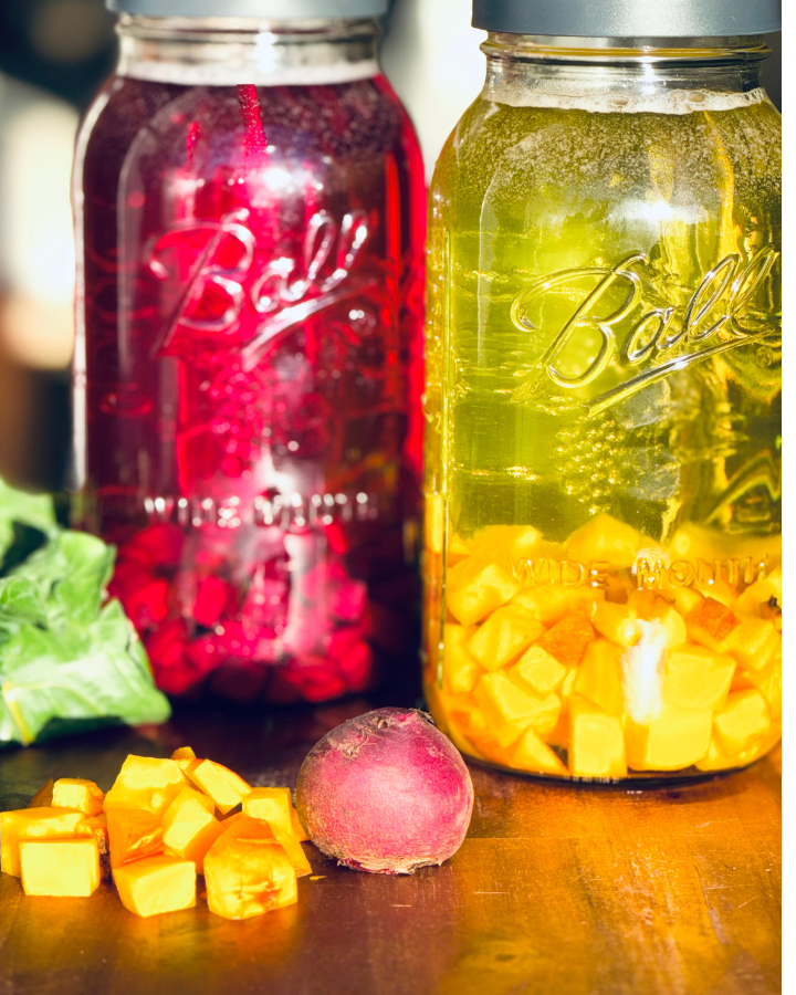 Beet kvass in jars on counter.