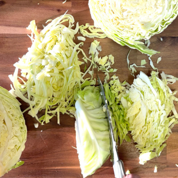 Chop cabbage on cutting board