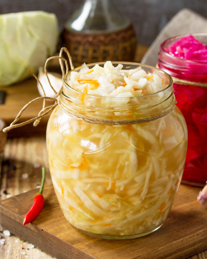 Easy homemade sauerkraut in jar on board